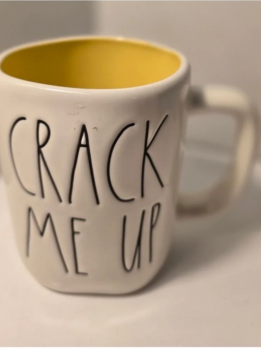 White Ceramic 'Crack Me Up' Mug with Yellow Interior